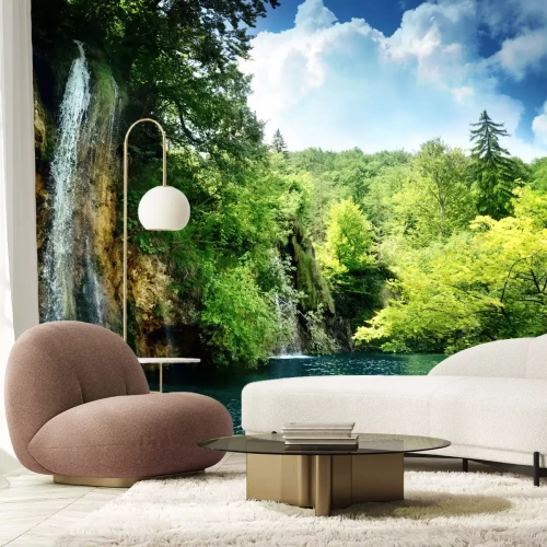 Fotobehang Jungle rotsen en een waterval