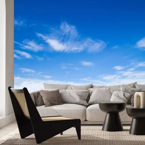 Fotobehang Wolken in de blauwe lucht