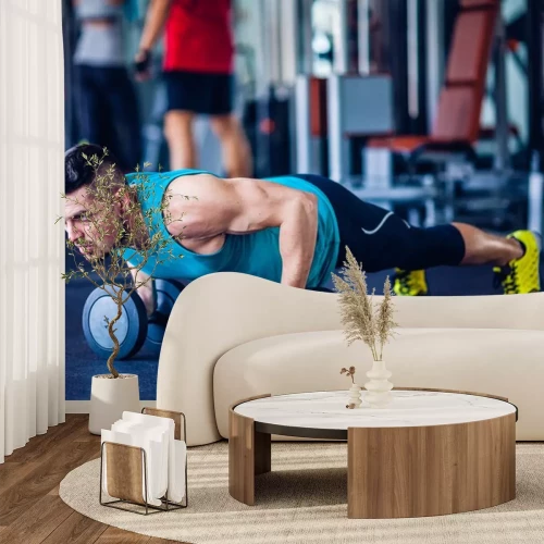 Sticker Crossfit instructeur op de sportschool doen pushups