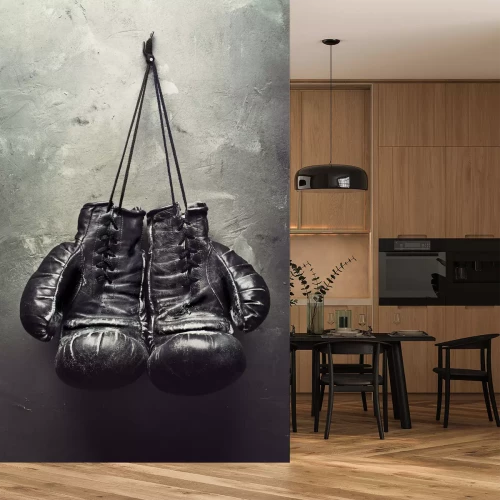 Fotobehang Zwarte handschoenen aan een haak