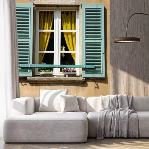 Fotobehang Een raam met blauwe luiken