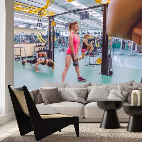 Sticker Trainer looking women group training in crossfit circuit