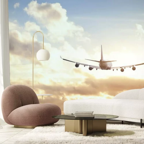 Fotobehang Een vliegtuig dat naar de zon vliegt