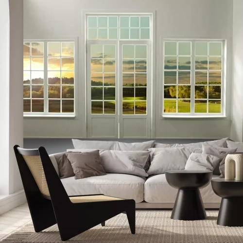 Fotobehang De ramen van het huis kijken uit op de weide