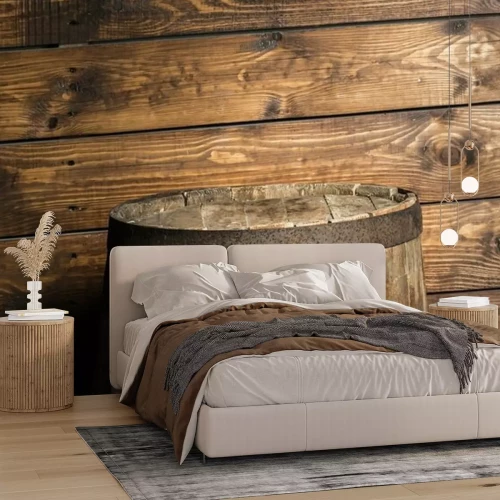 Fotobehang Een vat tegen een achtergrond van ruwe houten planken