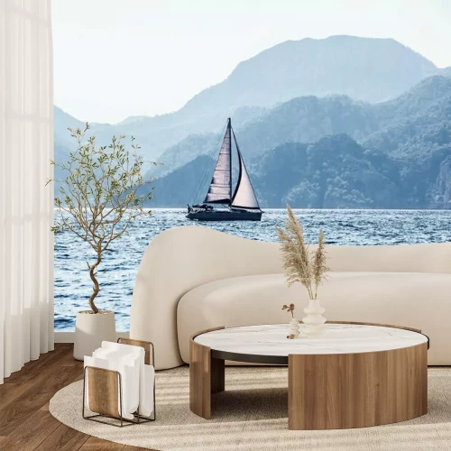 Fotobehang Zeilboot en bergachtig eiland