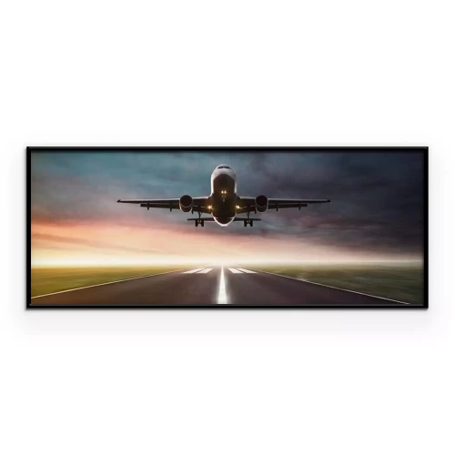 Poster Een vliegtuig landt op de landingsbaan.