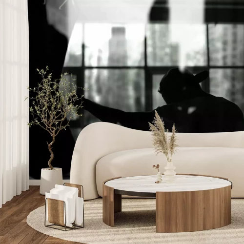 Fotobehang Een bokser die op een bokszak slaat