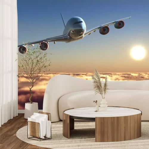 Fotobehang Een passagiersvliegtuig boven de wolken