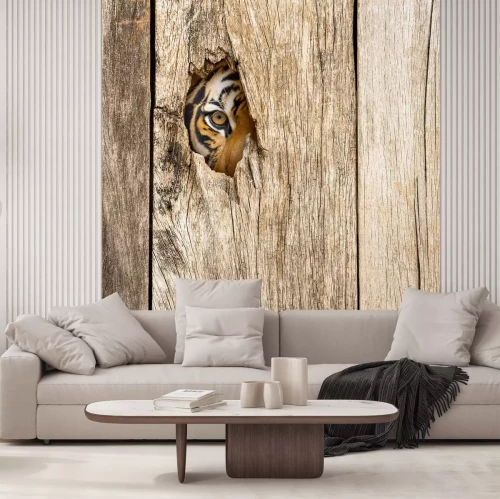 Fotobehang Tijger kijkt door een gat