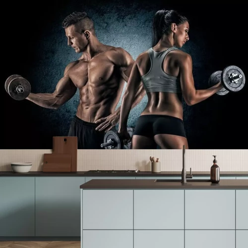 Fotobehang Gespierde man en vrouw met halters op een donkere achtergrond