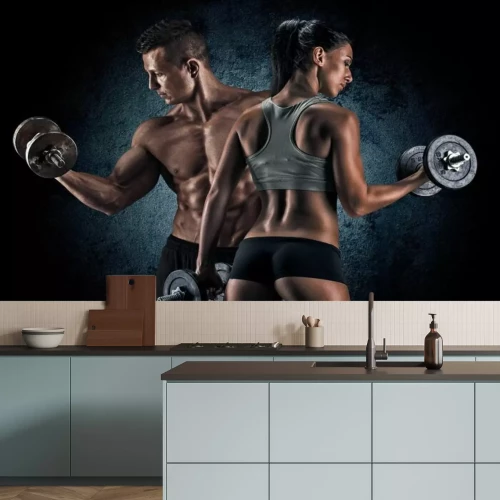 Fotobehang Sportief stel traint met halters