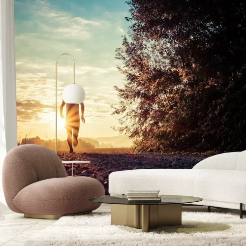 Fotobehang Een man rent in het park bij zonsondergang