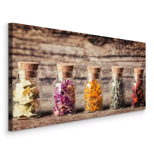Canvas Glazen flesjes met kruiden op een ruwe houten achtergrond