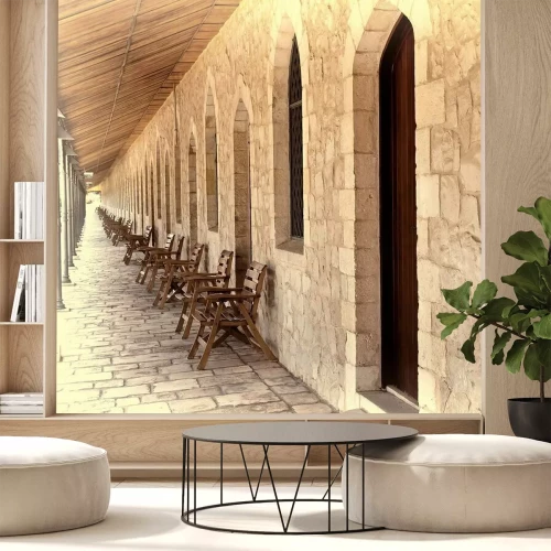 Fotobehang Stenen arcade met stoelen