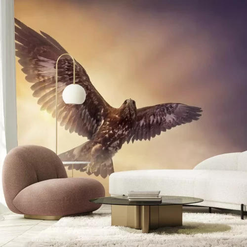 Fotobehang Een adelaar vliegend tegen de achtergrond van zonnestralen