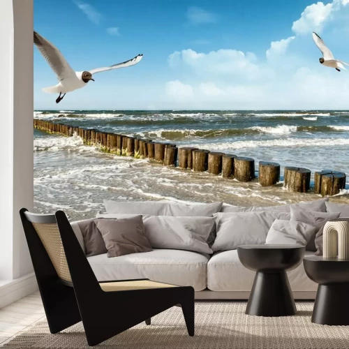 Fotobehang Meeuwen, zee en golfbreker