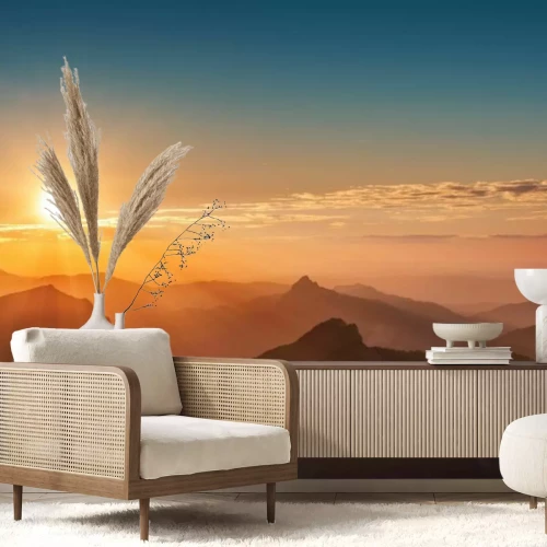 Fotobehang Zonsondergang over de bergen