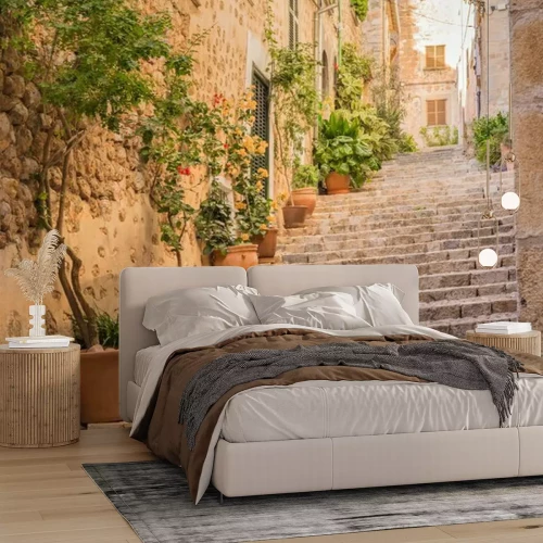 Fotobehang Een charmante straat met trappen en keramiek van mediterrane architectuur