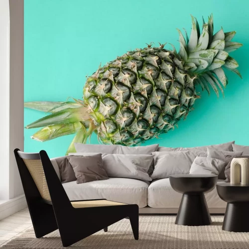 Sticker Foto van een ananas op een blauwe achtergrond
