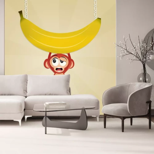 Sticker Een aap die een grote banaan vasthoudt