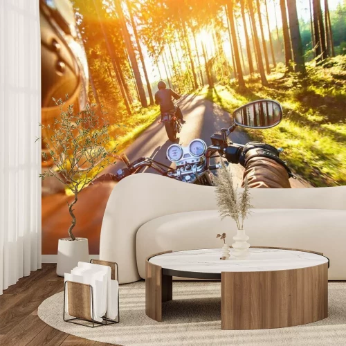 Fotobehang Man zit op een motorfiets in de zonsondergang