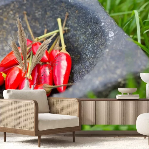 Sticker Verse rode paprika's in steenmortier op groen gras