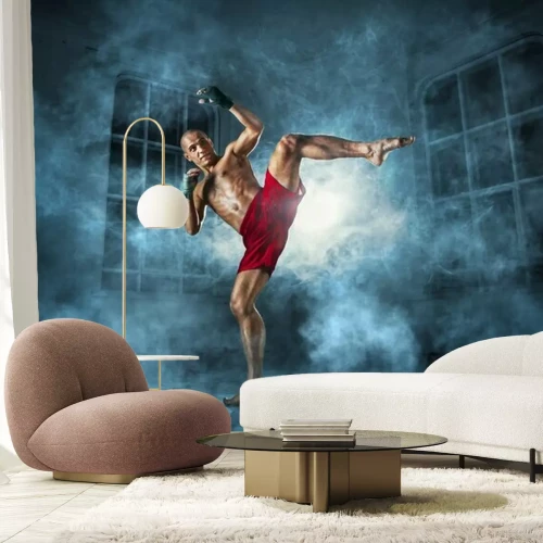 Fotobehang Mannelijke kickbokser tijdens de training