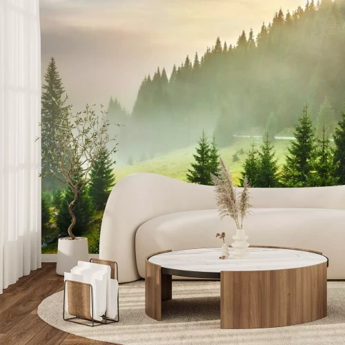 Fotobehang Groen gras en bomen op een berghelling