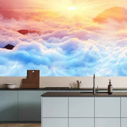 Fotobehang De zon boven de zee van wolken