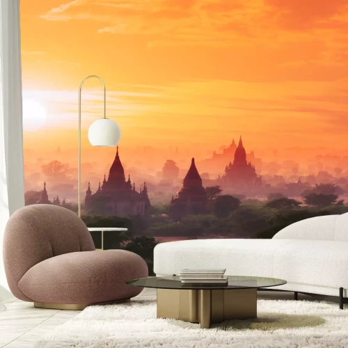 Fotobehang Zonsondergang boven Boeddhistische tempels