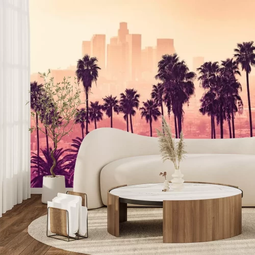 Fotobehang Palmbomen tegen de skyline van Los Angeles bij zonsondergang