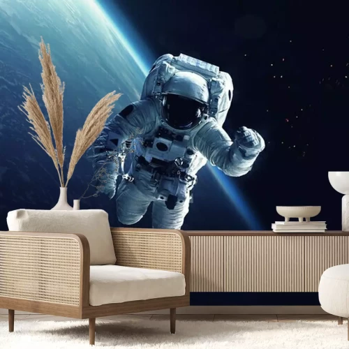 Fotobehang Kosmonaut met de aarde op de achtergrond