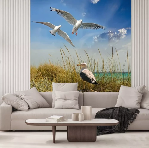 Fotobehang Meeuwen boven de zonnige zee