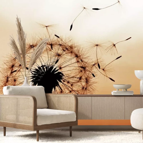 Fotobehang Paardenbloem op een oranje achtergrond