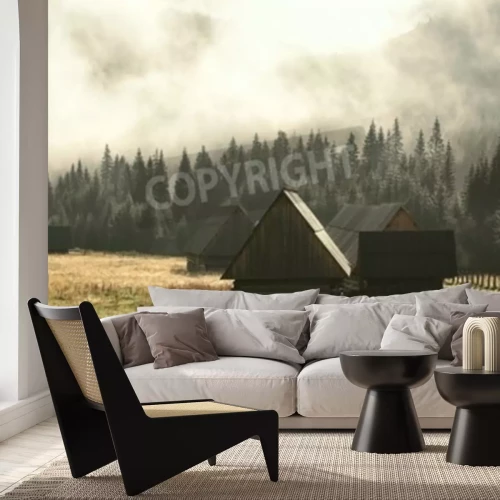 Fotobehang Berghutjes tegen de achtergrond van een bos