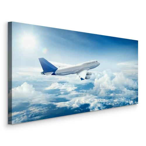 Canvas Een vliegtuig dat boven de wolken vliegt