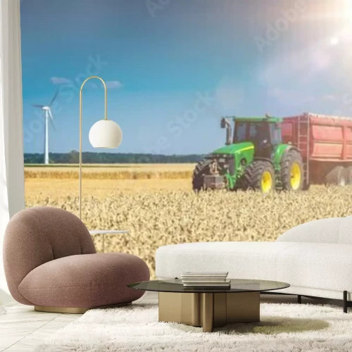 Fotobehang Tractor auf Feld mit Sonne
