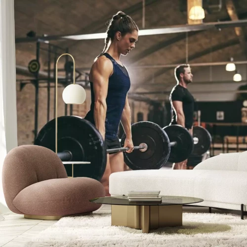 Fotobehang Mensen tillen gewichten op een halter