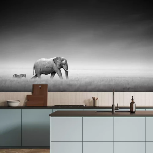 Fotobehang Een zebra volgt een olifant in het hoge gras.