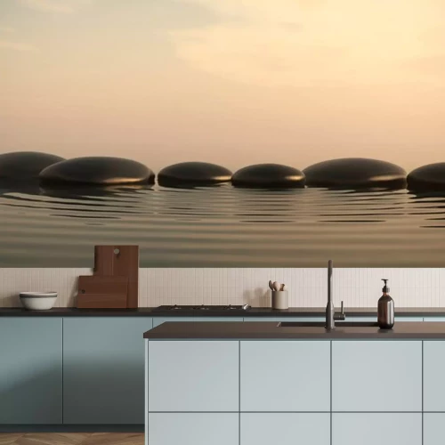 Sticker Zen stenen in het water op zonsopgang