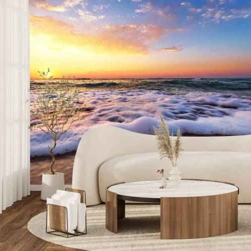 Fotobehang Stromende golven en zonsopgang