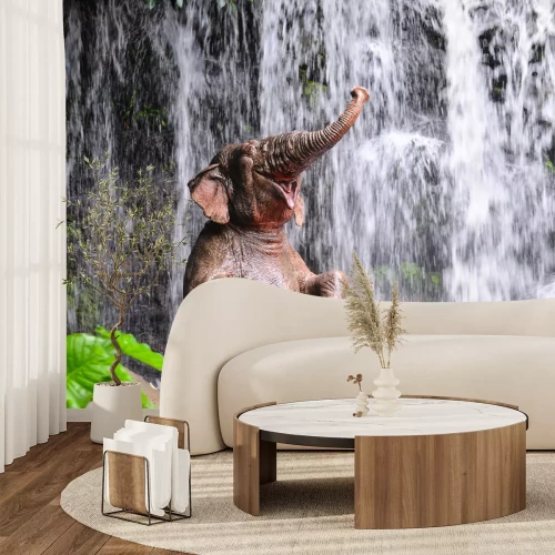 Fotobehang Olifant en een waterval in de jungle