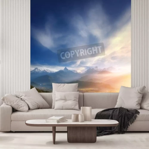 Fotobehang Zonsopgang boven een vallei van bergen