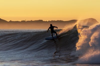 Fotobehang Watersporten bij zonsondergang