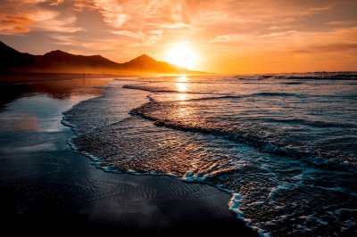 Fotobehang Zonsondergang strand