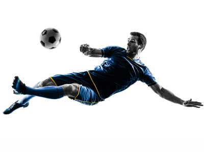 Sticker One caucasian soccer player man playing kicking in silhouette isolated on white background