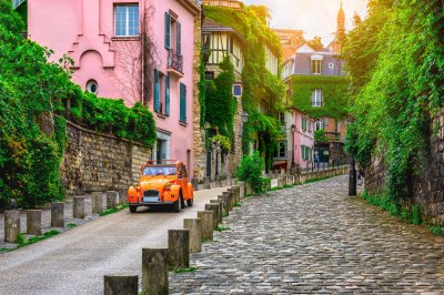 Fotobehang View of old street in quarter Montmartre in Paris, France. Cozy cityscape of Paris. Architecture and landmarks of Paris. 