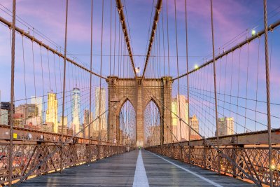 Fotobehang New York, New York on the Brooklyn Bridge Promenade facing Manhattan's skyline at dawn.