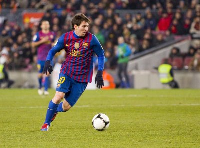 Fotobehang Voetballer Lionel Messi tijdens een wedstrijd